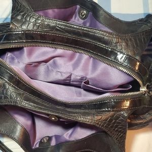 Black Coach shoulder bag with purple lining